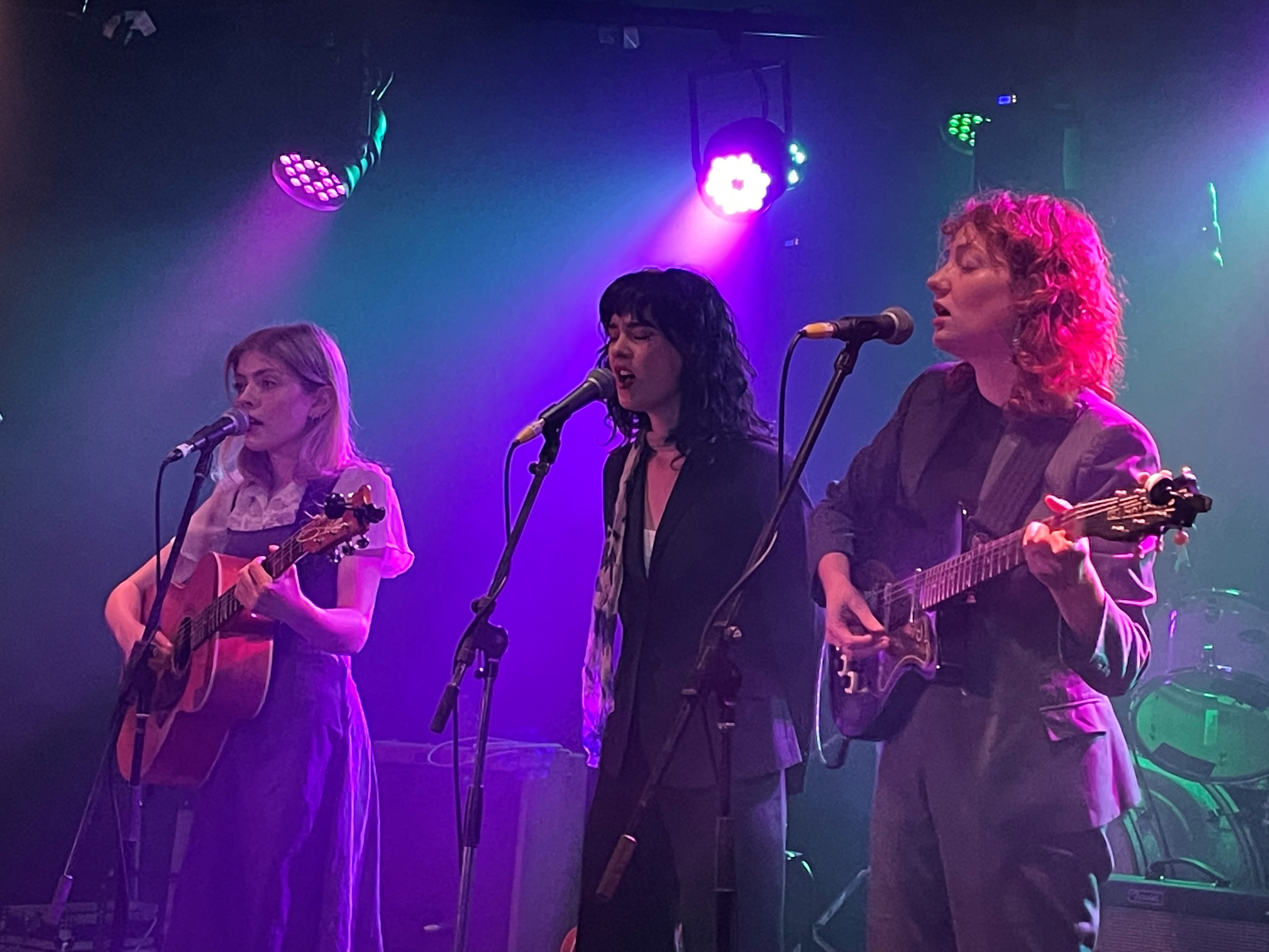 A photo of three people playing music