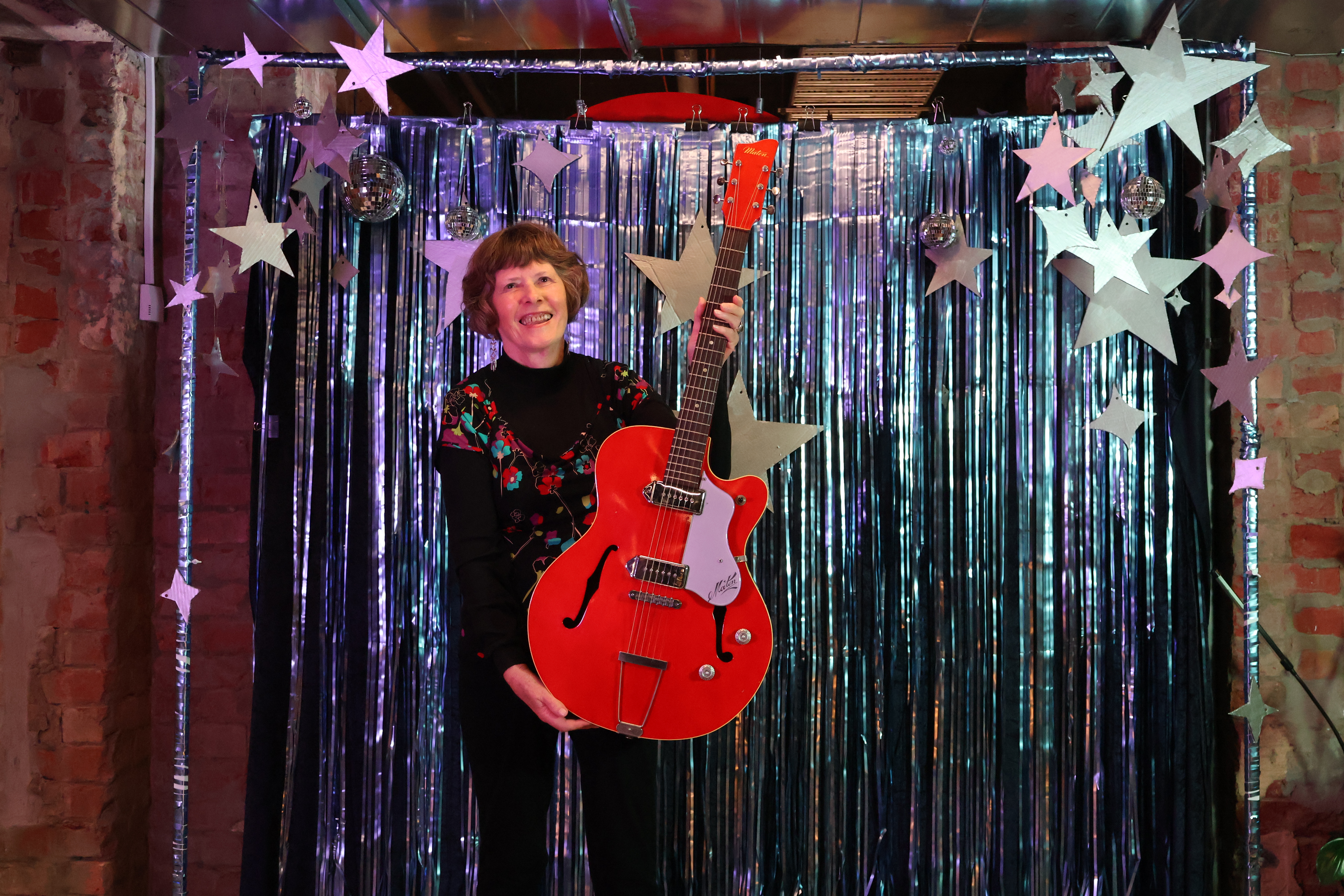 Jan Dale holding a guitlar Jan Dale holding a guitlar